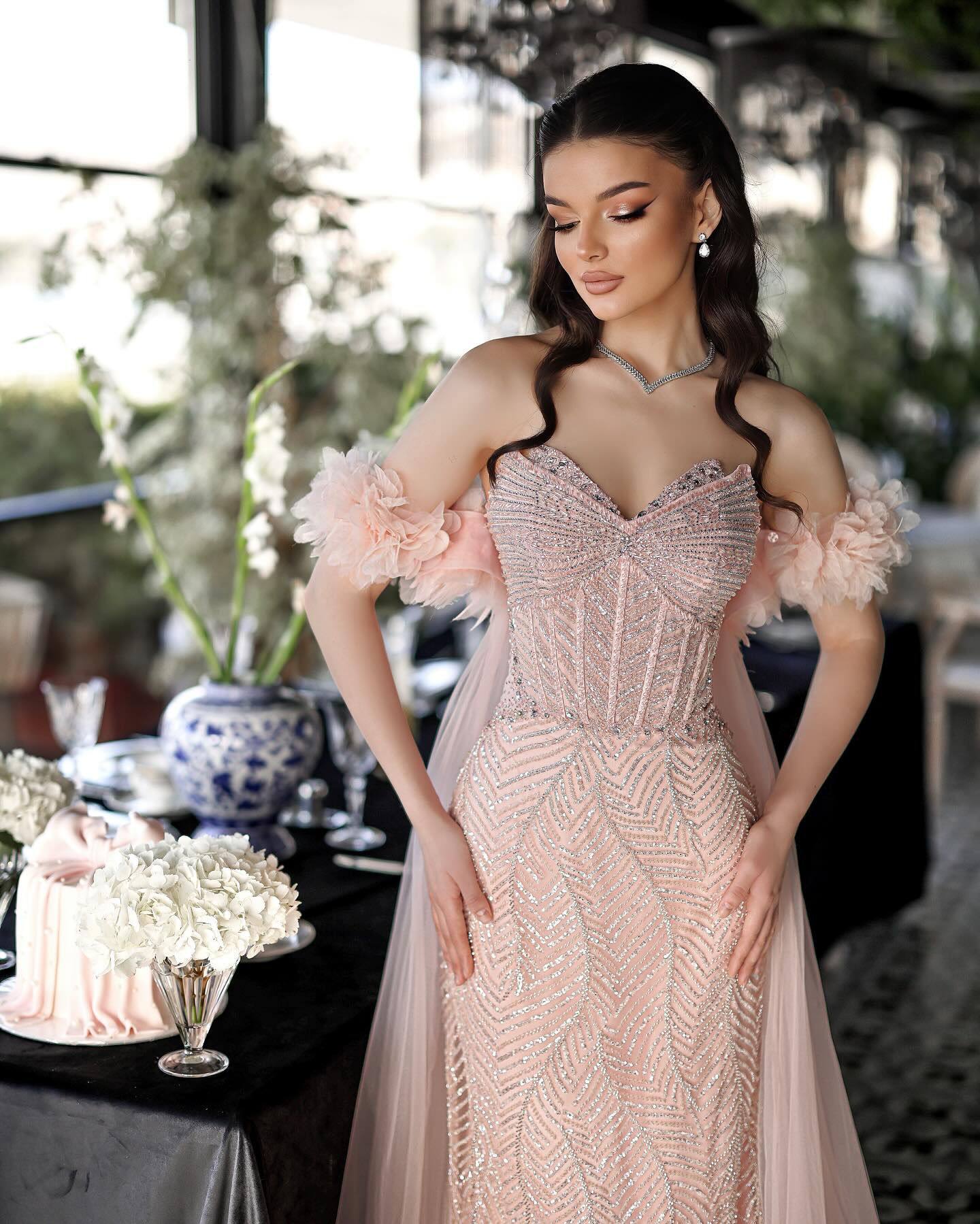 Floral sleeves and crystal embroidery on a Muliphein gown